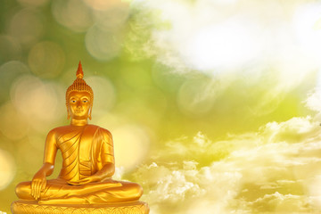 Buddha statue with bokeh on green - yellow sky background, Clipping Path