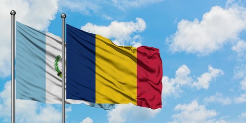 Guatemala and Chad flag waving in the wind against white cloudy blue sky together. Diplomacy concept, international relations.