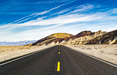 Road in the Desert Leading to the Painted Mountains of Death Valley - Death Valley National Park, California, USA 