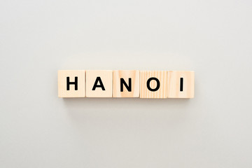 top view of wooden blocks with Hanoi lettering on grey background