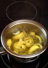Simmer lemon peel into syrup. Candied Lemon Zest Cooking. Series.
