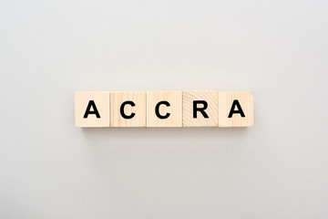top view of wooden blocks with Accra lettering on grey background
