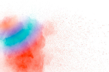 Colorful background of pastel powder explosion.Multi colored dust splash on black background.Painted Holi.