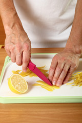 Cut lemon peels into strips. Candied Lemon Zest Cooking. Series.