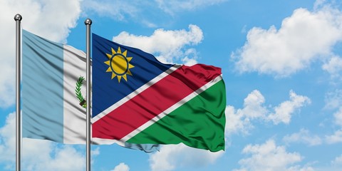 Guatemala and Namibia flag waving in the wind against white cloudy blue sky together. Diplomacy concept, international relations.