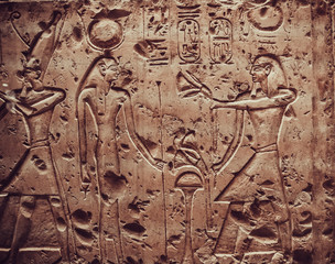 old egypt hieroglyphs carved on the stone