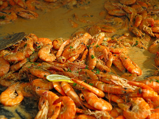 Delicious grilled tiger shrimps prawns with lemon and herbs