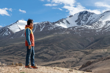 Traveler man enjoy at Tso Moriri Lake , Background is Snow top mountain,  Jammu and Kashmir, India