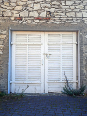old wooden window with shutters garage