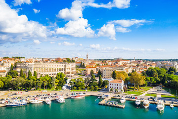 Croatia, city of Pula, ancient Roman arena, historic amphitheater and old town center from drone, aerial view