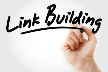 Hand writing Link Building with marker