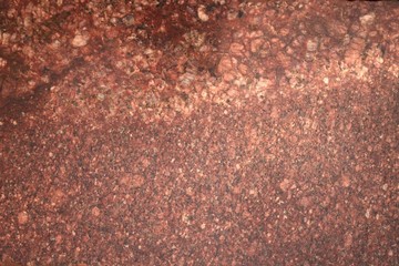 Background.Texture. Natural polished stone . Red granite.