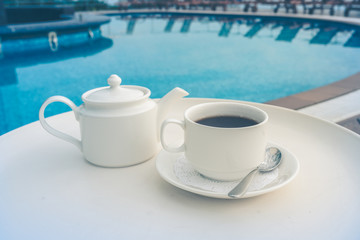 tea set on plate near spa pool