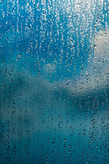 rain drops on window blue background