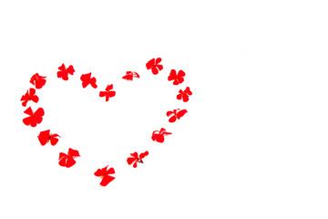 heart pattern of red natural flowers geranium on a white background