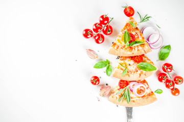 Pieces of cheese pizza Margarita, set like christmas tree. White stone background top view. Christmas and New year party food idea