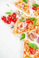 Pieces of cheese pizza Margarita with ingredients and herbs. White stone background top view
