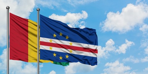 Guinea and Cape Verde flag waving in the wind against white cloudy blue sky together. Diplomacy concept, international relations.