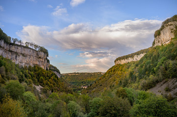 View to Baume-les-Messieurs and the Romanesque abbey, Abbaye Impériale, with a heritage that goes back to the Carolingian era of 9th century.