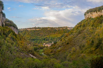 View to Baume-les-Messieurs and the Romanesque abbey, Abbaye Impériale, with a heritage that goes back to the Carolingian era of 9th century.