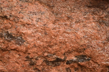 Background, texture. Natural stone granite. multi-colored - red, gray.