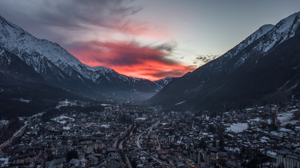 Aerial drone view of red evening glow over Chamonix Mont Blanc, in French Alps