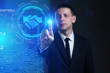 Business, Technology, Internet and network concept. Young businessman working on a virtual screen of the future and sees the inscription: