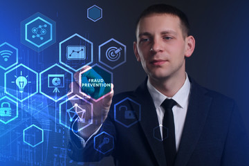 Business, Technology, Internet and network concept. Young businessman working on a virtual screen of the future and sees the inscription: Fraud prevention