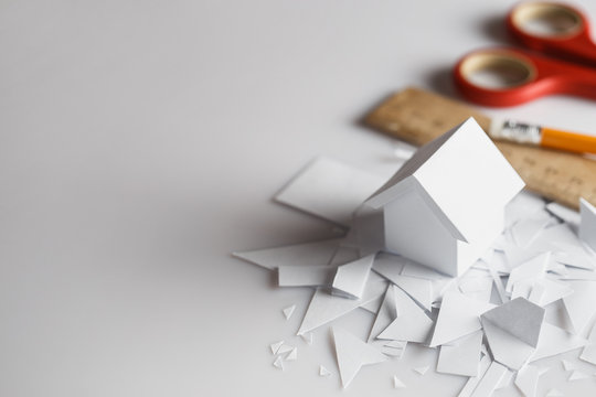 White house handmade out of paper, for real estate property industry, with copy space