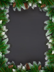 Christmas decoration with fir branches and spruce tufts on dark background with copy space. Banner mockup, postcard. Flat lay, top view, overhead.