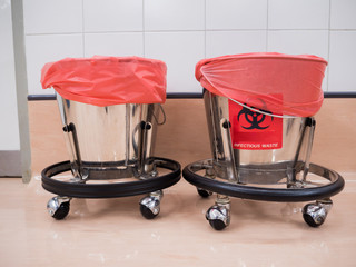 Bins, containers for disposing of infectious waste or contaminated items In doing karma in the...