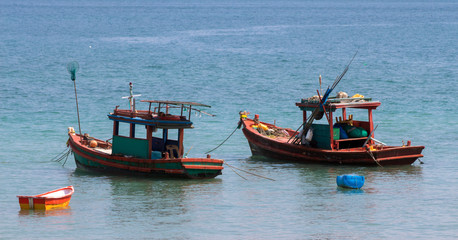 Small fishing boat in the middle of the sea. Local fishery business