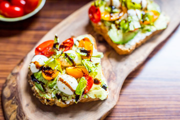Toasts with Cherry Tomatoes, Mozzarella Cheese, Basil Leaves and Balsamic Sauce