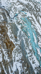 Fototapeta na wymiar Overhead aerial drone view of tourists enter ice cave glacier in Montenvers, near Chamonix, French Alps