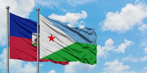 Haiti and Djibouti flag waving in the wind against white cloudy blue sky together. Diplomacy...