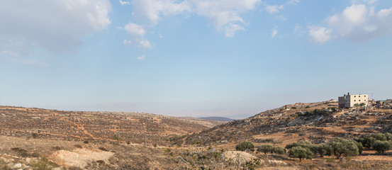 View from the highway number 5 to the Palestinian village Ayn as Sararah located on a hill in Samaria region in Benjamin district, Israel - obrazy, fototapety, plakaty