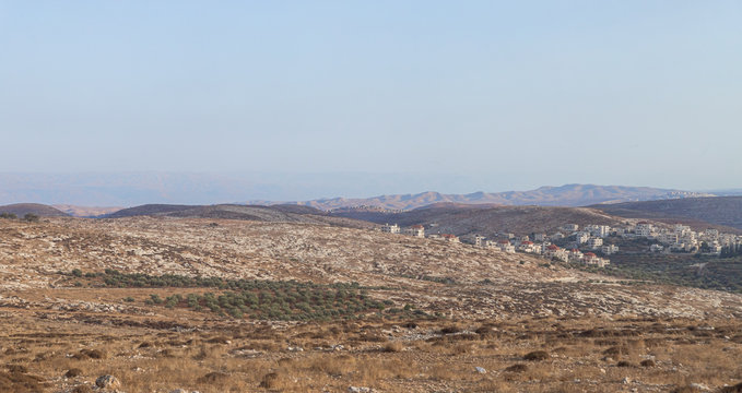 View from the highway number 5 to Jordan mountains and the Palestinian village Mukhamas located on a hill in Samaria region in Benjamin district, Israel