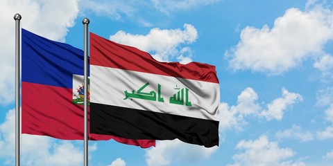 Haiti and Iraq flag waving in the wind against white cloudy blue sky together. Diplomacy concept, international relations.
