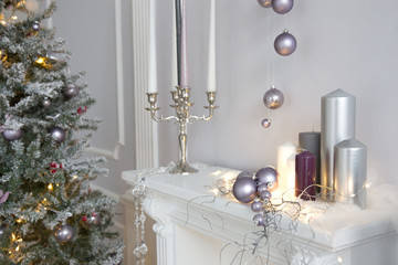 Christmas decorations in photo studio. Interior with snowman, Christmas tree, lanterns, deer and others. 