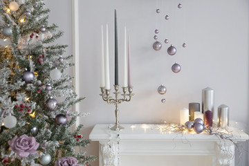 Christmas decorations in photo studio. Interior with snowman, Christmas tree, lanterns, deer and others. 