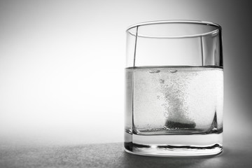 Fizzy tablet in a glass of water