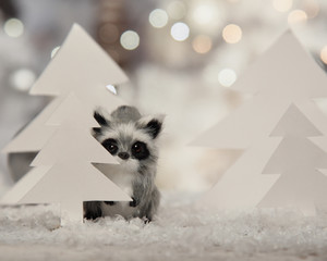 Cute Christmas Racoon Hiding Behind Paper Tree