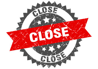 close grunge stamp with red band. close