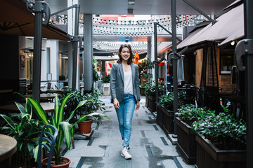 Modern content Asian lady walking on street