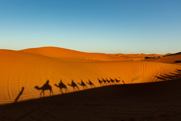 Fototapeta na wymiar European tourists in Sahara Desert during sunset, Merzouga, Morocco