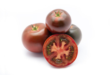 Kumato tomatoes on a white background