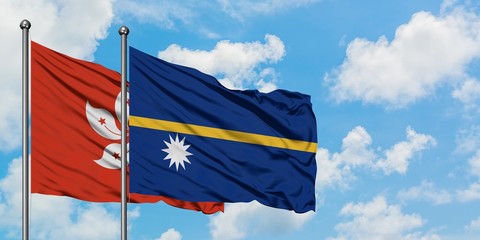 Hong Kong and Nauru flag waving in the wind against white cloudy blue sky together. Diplomacy concept, international relations.