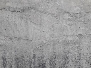 Gray cement walls are suitable for making a construction industry background.