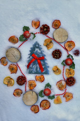 Christmas blue  tree  and  red beads on   background  with  snow