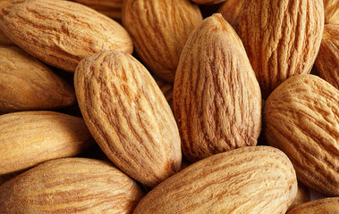 Background of big raw peeled almonds